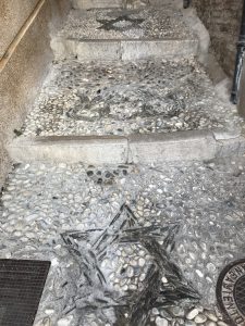 A stone staircase with Star of David patterns