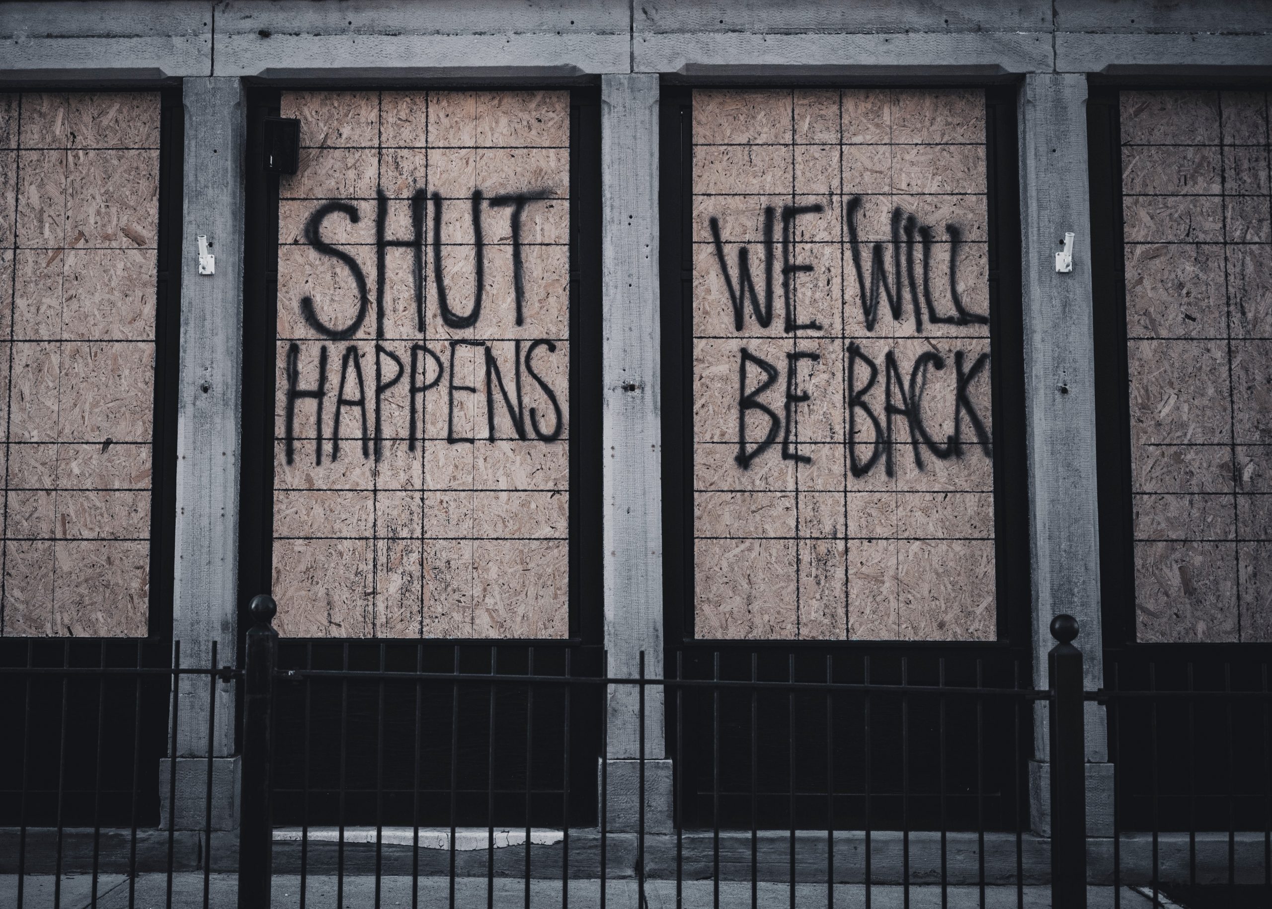 Closed store with graffiti - Shut happens we will be back