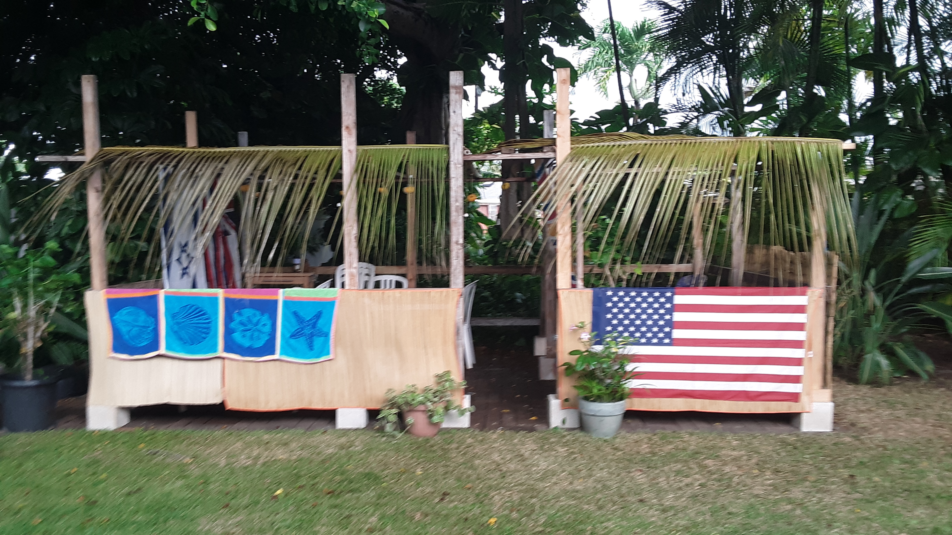 Sukkah decorations - two booths with fronds.